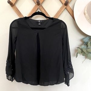 Black blouse with sleeve details